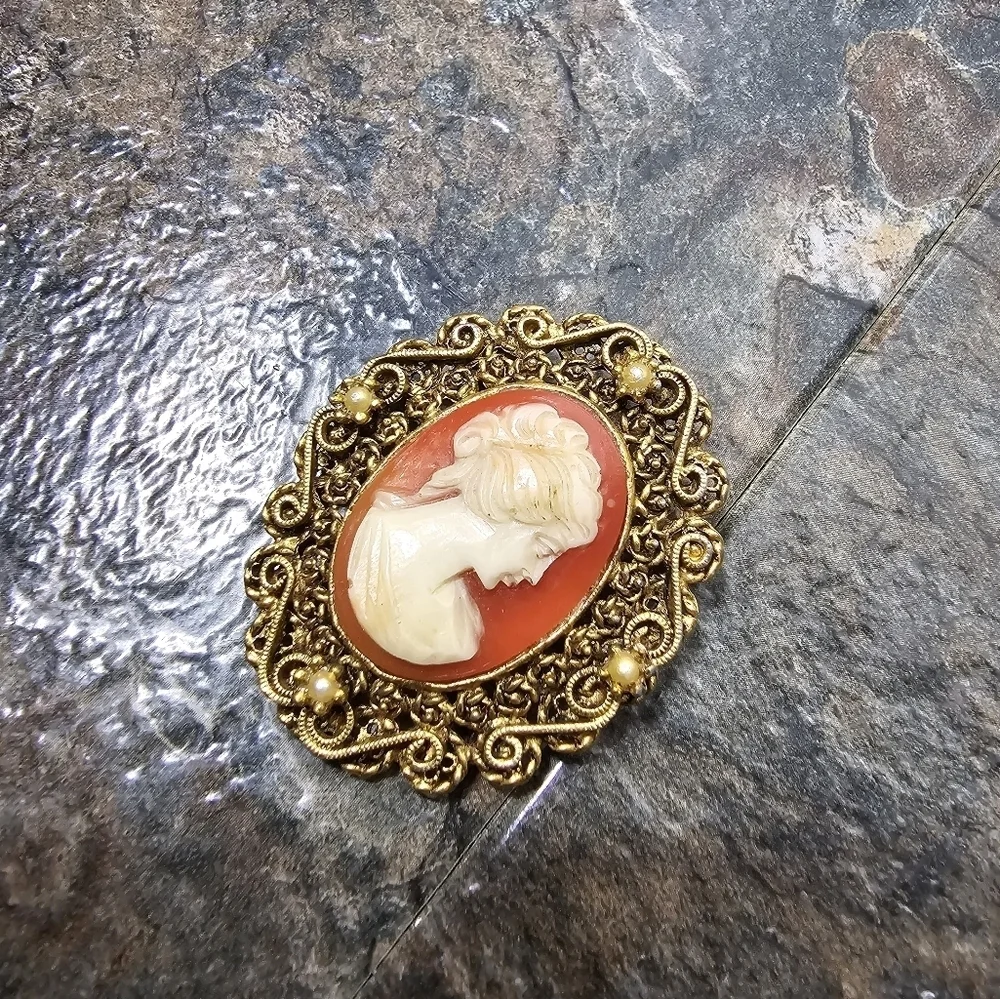 gold, orange, cream cameo brooch with pearls